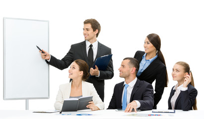 Manager showing something on screen to business people