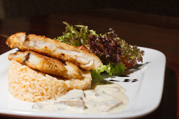 Close image of business lunch rise with fish and salad