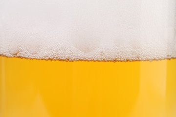 Closeup of beer and foam.