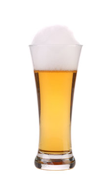 Full glass of beer with foam.