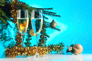 glasses with champagne and Christmas ornaments