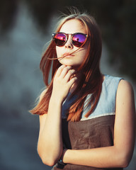 teenage girl in sunglasses.