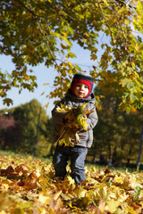 Child holding leaves