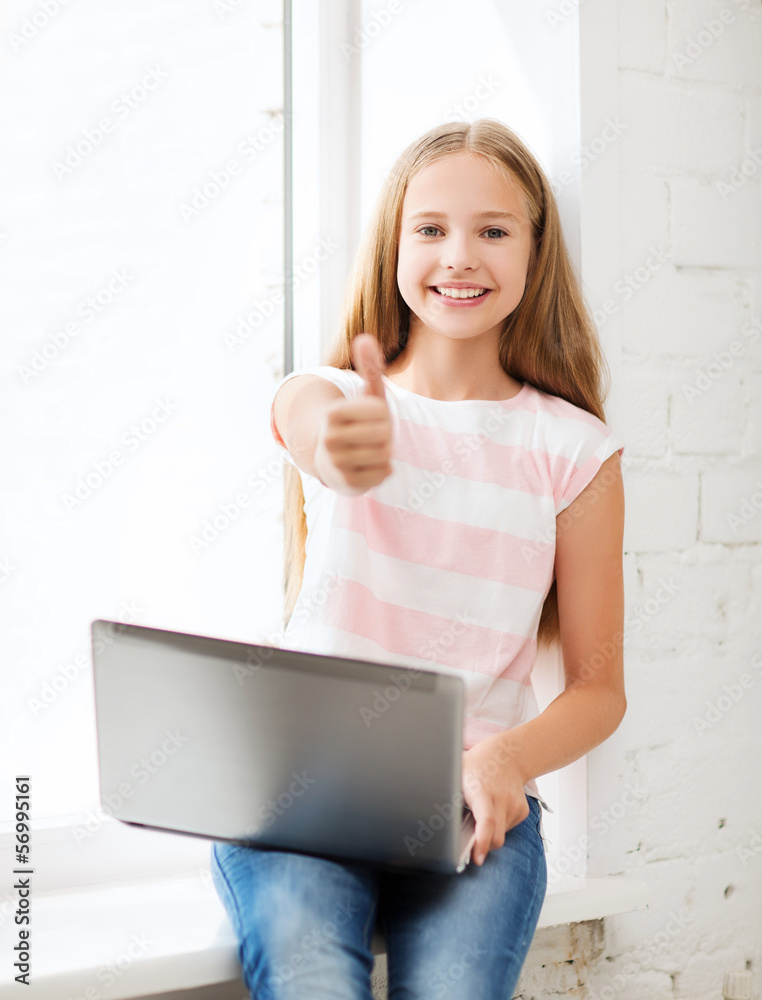 Poster girl with laptop pc at school