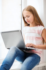 girl with laptop pc at school