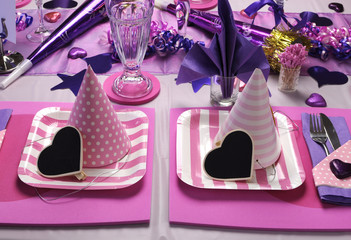 Pink & purple theme party table setting decorations.