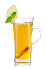 Glass of hot fruit tea with fresh mint and spices isolated
