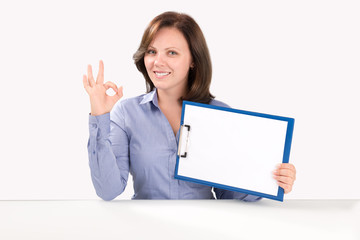 Fototapeta premium Business woman is holding a blank clipboard