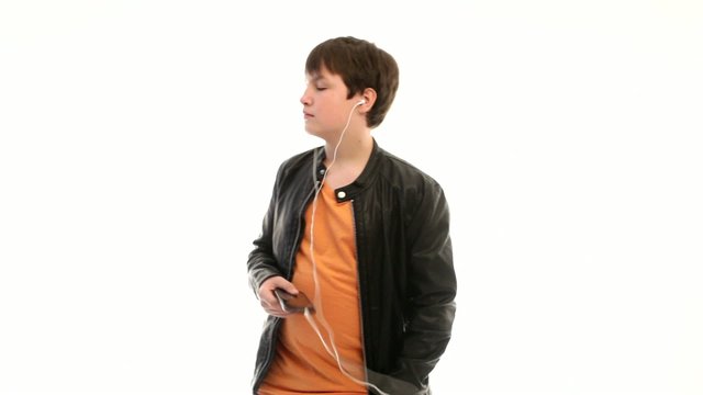 Teenage boy in leather jacket listening to music