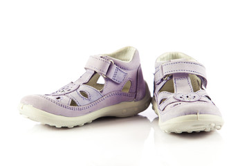 purple sandals for kids. children's shoes isolated on a white ba