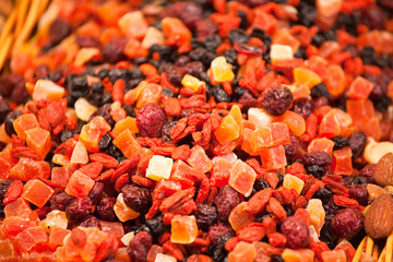 Scattering of different candied fruits on counter