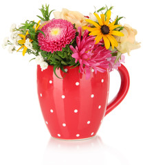 Naklejka premium Beautiful bouquet of bright flowers in color mug, isolated