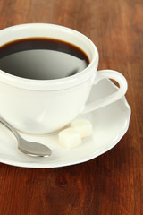 Coffee cup on wooden table close-up