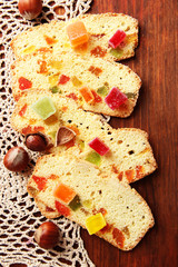 Biscotti with candied fruits, on wooden background