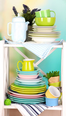 Beautiful white shelves with tableware and decor,