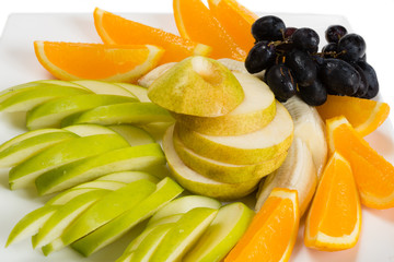 Fototapeta na wymiar Assorted fruits of orange, apple, grapes, pear