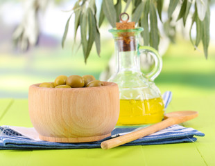 Olive oil and olives in bowl