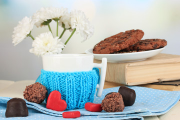 Cup with knitted thing on it close up