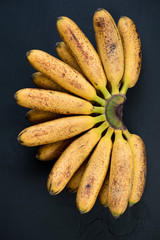 Bunch of ripe mini bananas, view from above