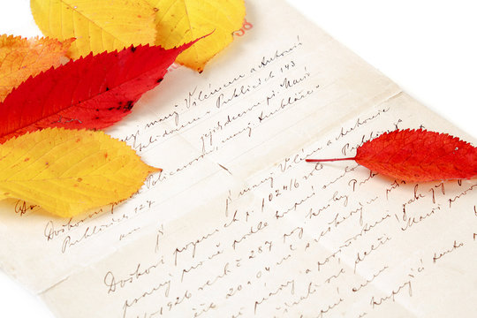 handwritten letter with autumn leaves