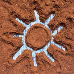 Painted sun on ground coffee