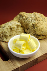 Australian traditional damper bread with butter curls.