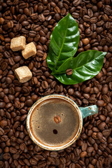 Cup of espresso coffee on a background coffee beans