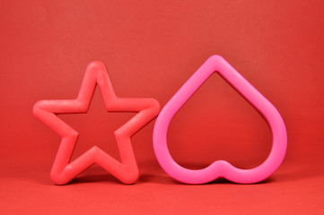 Fototapeta premium Red and pink star and heart shape cookie cutters