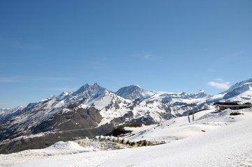 Fototapeta na wymiar Dom across snowfields at Gornergrat in Swiss Alps