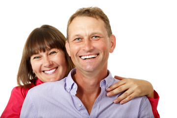 Attractive cheerful woman with man in love smiling over white ba