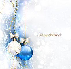 Blue Christmas background with two Christmas baubles