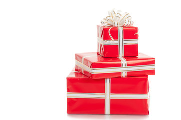 Wrapped gifts with a bow on a white background.