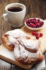 Sweet buns with cup of coffee