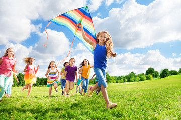 Cool girl with kite and her friends
