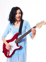 Fototapeta premium Young woman playing the guitar
