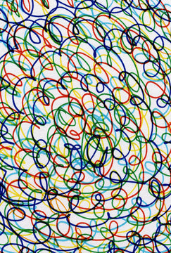 Abstract colour curves scribbles on white paper.