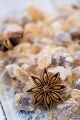 Fototapeta na wymiar Star anise on brown sugar, Christmas spices