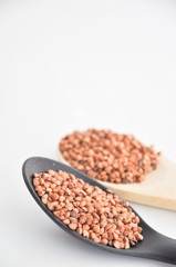 Fototapeta premium buckwheat in a bowl with spoon