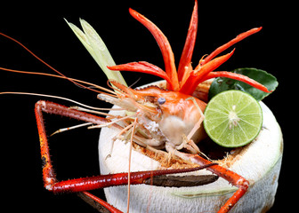 Tom Yum Goong - Thai hot and spicy soup seafood in coconut fruit