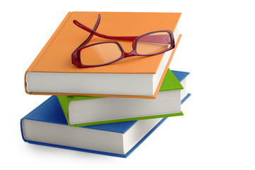 glasses on a stack of books