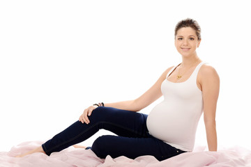 Fototapeta premium Pregnant woman over white background