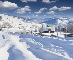 Fototapeta premium Sunny landscape in the mountain village.