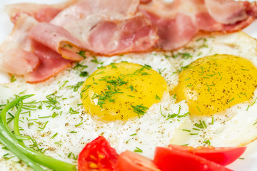 Fototapeta na wymiar Fried eggs with bacon
