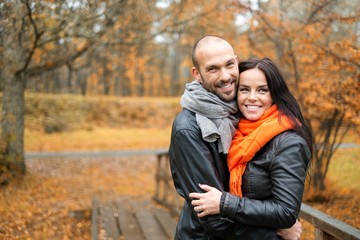 Fototapeta premium Happy middle-aged couple outdoors on beautiful autumn day