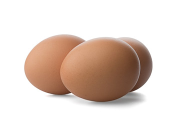 Three Chicken Brown eggs on white background