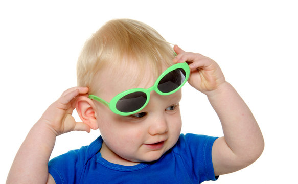 Cute baby boy with green sunglasses