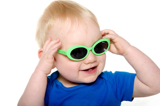 Cute baby boy with green sunglasses