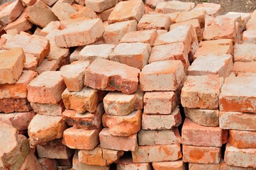 Stack of old used bricks
