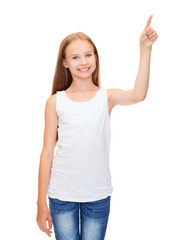 girl in blank white shirt pointing to something