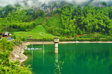 Fototapeta premium Beautiful emerald mountain lake in Switzerland